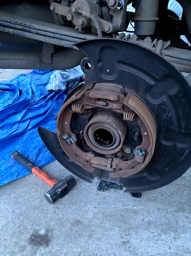 Rear wheel bearing and axle seal replacement